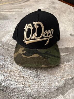 10.Deep Black Cap with Camo Brim and Cream Logo